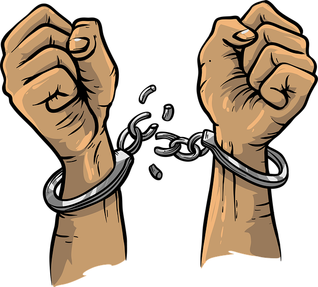 hands breaking free from handcuffs