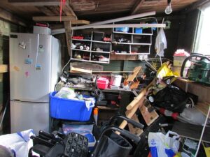 garage space filled with clutter and junk