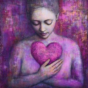 woman holding pink heart